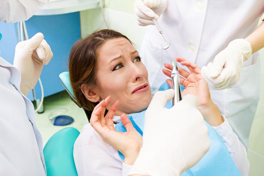 Endodontist North Miami trying to make a scared patient comfortable by explaining the procedure