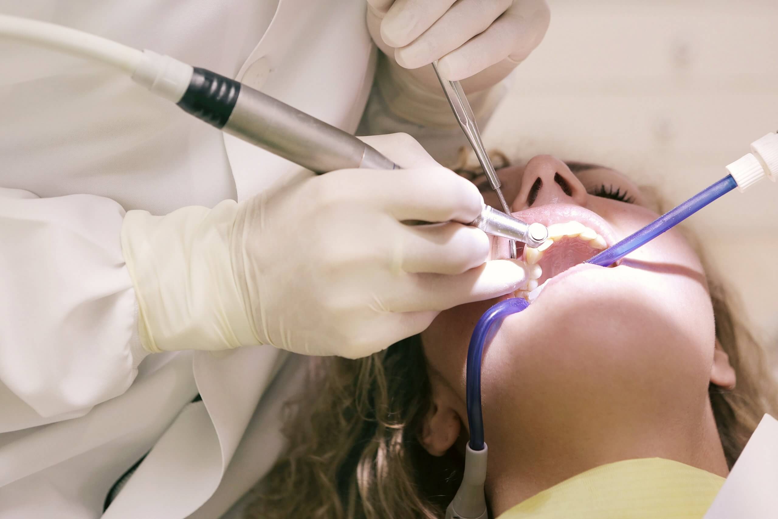 the best Aventura Dentist gives quality dental care to a patient
