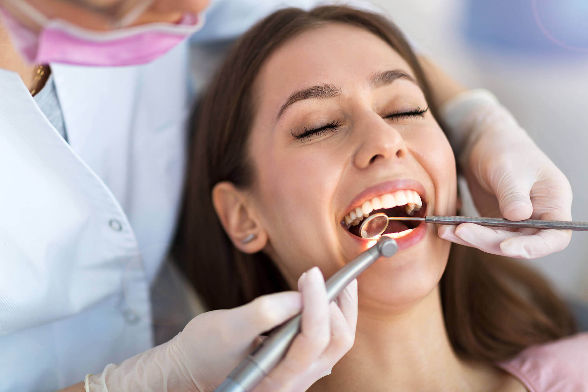 North Miami dentist checks patient's teeth